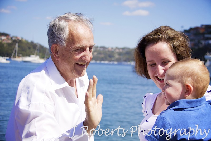 Little boy giving grandpa high five - family portrait photography sydney